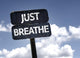 Just Breathe sign with clouds and sky background Wall Mural