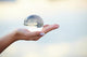 Crystal ball on hand Wall Mural