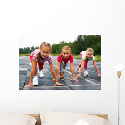 Girls Starting to Run Wall Mural shown on a wall