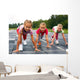 girls starting to run on track Wall Mural