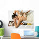 portrait of young beautiful woman in spa environment, massage wi Wall Mural
