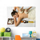 portrait of young beautiful woman in spa environment, massage wi Wall Mural