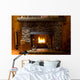close-up of stone fireplace in log cabin with blazing fire Wall Mural
