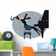 Young girl playing a piano Wall Mural