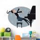 Young girl playing a piano Wall Mural
