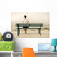 Woman sitting on bench Wall Mural