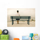 Woman sitting on bench Wall Mural
