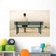 Woman sitting on bench Wall Mural