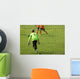 Young boys play football match Wall Mural
