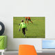 Young boys play football match Wall Mural