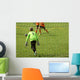Young boys play football match Wall Mural