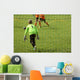 Young boys play football match Wall Mural