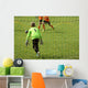 Young boys play football match Wall Mural