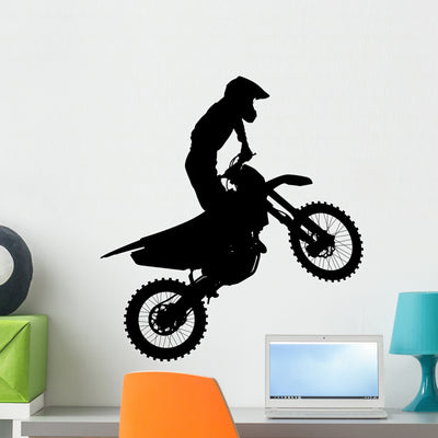 Black Silhouettes Motocross Rider Wall Decal shown on a wall