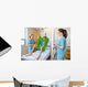 Nurses Looking At Patient Sitting On Cloth Of Hydraulic Lift Wall Mural