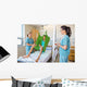 Nurses Looking At Patient Sitting On Cloth Of Hydraulic Lift Wall Mural