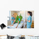Nurses Looking At Patient Sitting On Cloth Of Hydraulic Lift Wall Mural