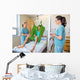 Nurses Looking At Patient Sitting On Cloth Of Hydraulic Lift Wall Mural