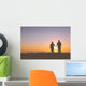 Senior couple holding hands silhouettes Wall Mural