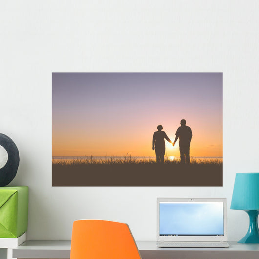 Senior couple holding hands silhouettes Wall Mural