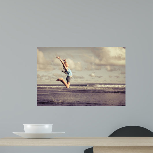 Teen Girl Jumping Beach Wall Decal