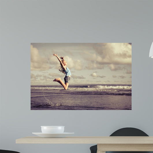 Teen Girl Jumping Beach Wall Decal