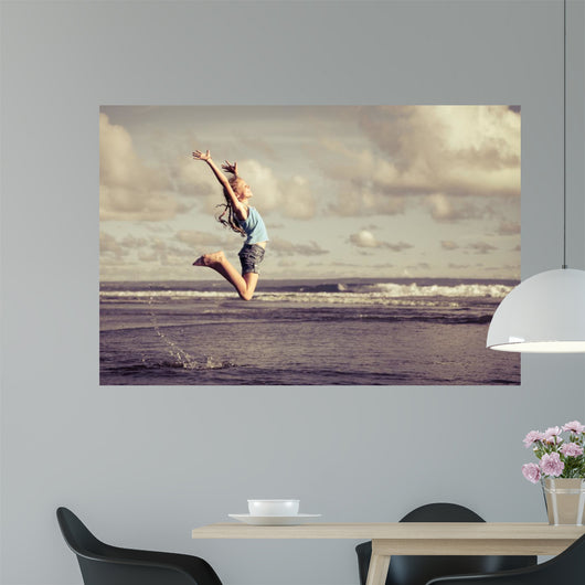 Teen Girl Jumping Beach Wall Decal