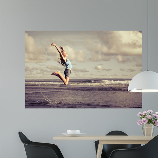 Teen Girl Jumping Beach Wall Decal
