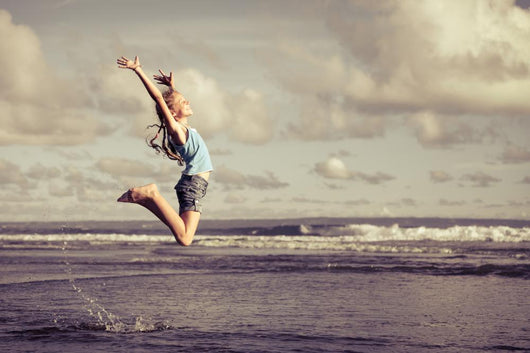 Teen Girl Jumping Beach Wall Decal