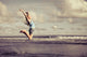 Teen Girl Jumping Beach Wall Decal