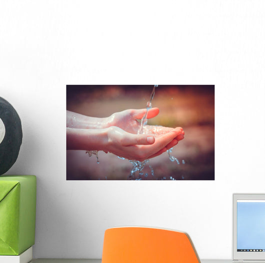 Woman's hands with water splash Wall Mural