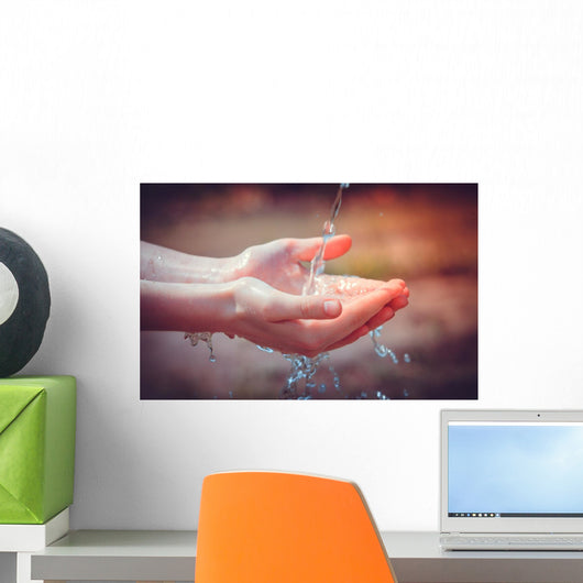 Woman's hands with water splash Wall Mural