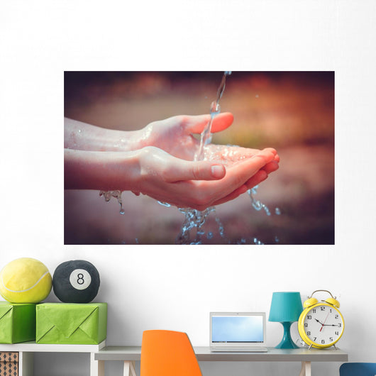 Woman's hands with water splash Wall Mural