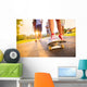 Young peoples legs with skateboard Wall Mural