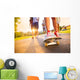 Young peoples legs with skateboard Wall Mural