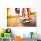 Young peoples legs with skateboard Wall Mural