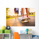 Young peoples legs with skateboard Wall Mural