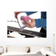 applying ski wax to ski base Wall Mural