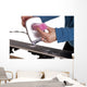 applying ski wax to ski base Wall Mural