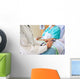 Female Doctor Sitting With Patient On Hospital Bed Wall Mural