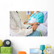 Female Doctor Sitting With Patient On Hospital Bed Wall Mural