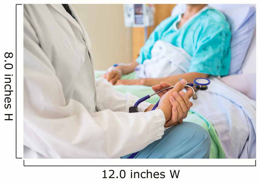 Female Doctor Sitting With Patient On Hospital Bed Wall Mural