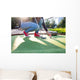 Young woman plays adventure/mini golf in summer evening Wall Mural