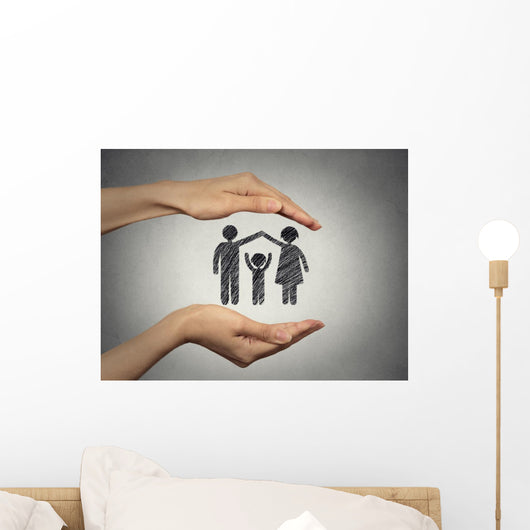 woman's hands protecting happy family, grey wall background  Wall Mural