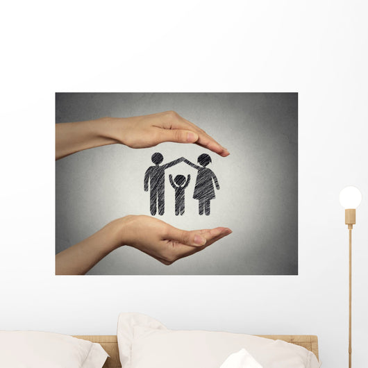 woman's hands protecting happy family, grey wall background  Wall Mural