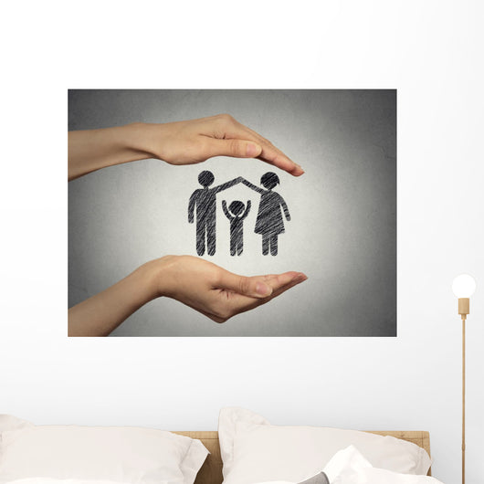 woman's hands protecting happy family, grey wall background  Wall Mural
