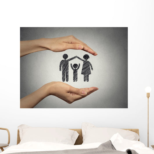 woman's hands protecting happy family, grey wall background  Wall Mural