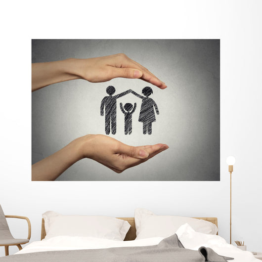 woman's hands protecting happy family, grey wall background  Wall Mural