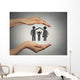 woman's hands protecting happy family, grey wall background  Wall Mural
