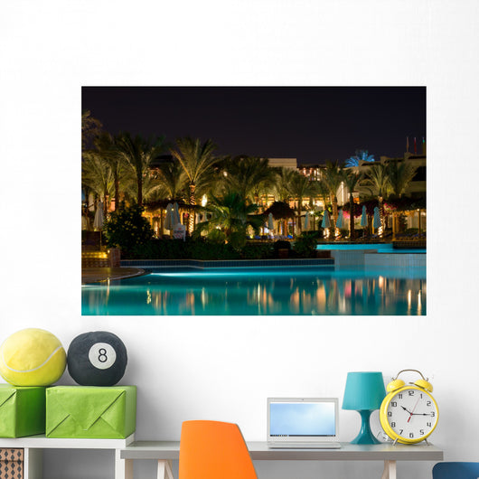 Night swimming pool side of tropical hotel Wall Mural